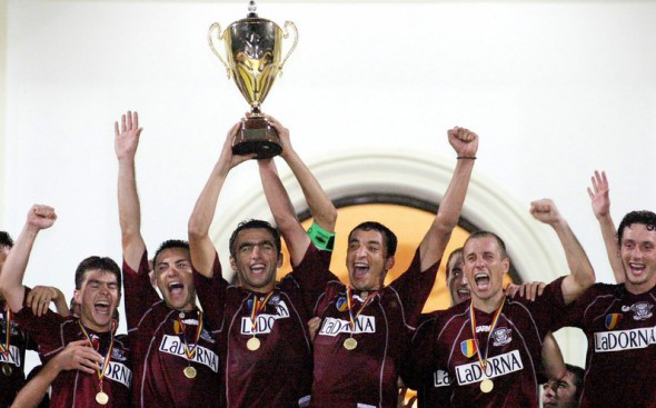 Rapid Bucharest's players celebrate after their captain Adrian Iencsi raises the Supercup trophy