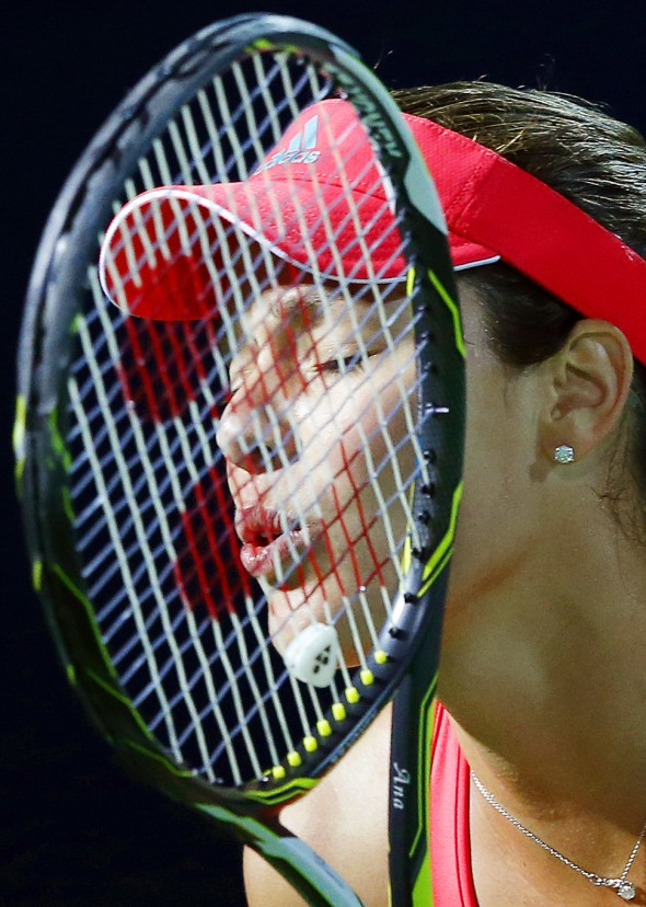epa05166515 Ana Ivanovic of Serbia reacts during her second round match against Simona Halep of Romania at the Dubai Duty Free Tennis WTA Championships in Dubai, United Arab Emirates, 17 February 2016. EPA/ALI HAIDER