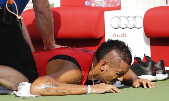 epa05180037 Nick Kyrgios of Australia receives treatment during his quarter final match against Tomas Berdych of the Czech Republic at the Dubai Duty Free Tennis ATP Championships in Dubai, United Arab Emirates, 25 February 2016. EPA/ALI HAIDER