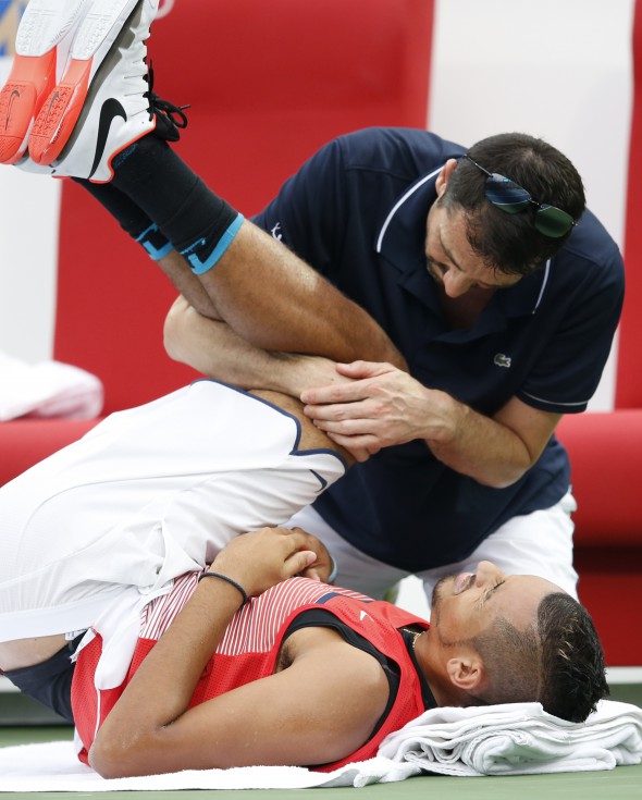 epa05182052 Nick Kyrgios of Australia receives treatments during his semi final match against Stanislas Wawrinka of Switzerland at Dubai Duty Free Tennis ATP Championships in Dubai, United Arab Emirates, 26 February 2016. EPA/ALI HAIDER