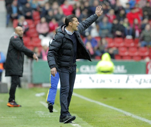 epa05184292 RCD Espanyol's Rumanian head coach Constantin Galca reacts during the Spanish Liga Primera Division soccer match against Sporting Gijon played at El Molinon stadium in Gijon, northern Spain, 27 February 2016. EPA/Alberto Morante