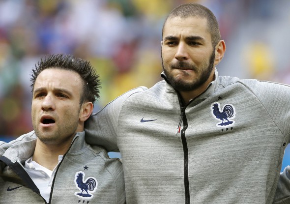 epa05063655 (FILE) File picture dated 30 June 2014 of French players Mathieu Valbuena (L) and Karim Benzema prior to the FIFA World Cup 2014 round of 16 match between France and Nigeria at the Estadio Nacional in Brasilia, Brazil. The French soccer federation announced 10 December 2015 that is suspending Karim Benzema from the national soccer team over a sex tape blackmail case involving team-mate Mathieu Valbuena. (RESTRICTIONS APPLY: Editorial Use Only, not used in association with any commercial entity - Images must not be used in any form of alert service or push service of any kind including via mobile alert services, downloads to mobile devices or MMS messaging - Images must appear as still images and must not emulate match action video footage - No alteration is made to, and no text or image is superimposed over, any published image which: (a) intentionally obscures or removes a sponsor identification image; or (b) adds or overlays the commercial identification of any third party which is not officially associated with the FIFA World Cup) EPA/JORGE ZAPATA EDITORIAL USE ONLY