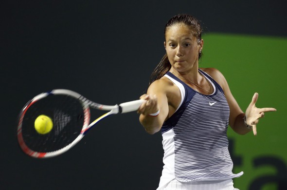 epa05230006 Daria Kasatkina of Russia in action against Simona Halep of Romania during their second round match at the Miami Open tennis tournament on Key Biscayne, Miami, Florida, USA, 24 March 2016. EPA/RHONA WISE